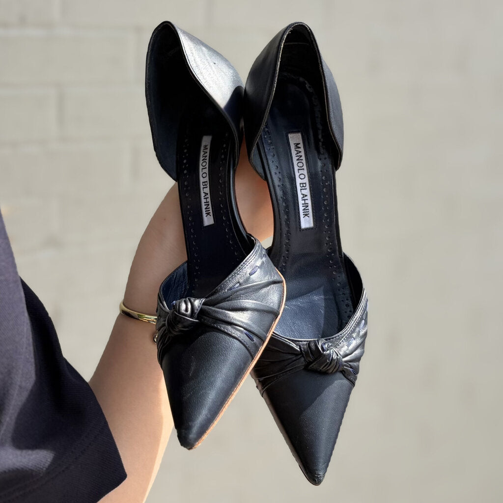Navy leather pointed-toe heels with knot bow detail and stiletto heel