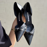 Navy leather pointed-toe heels with knot bow detail and stiletto heel