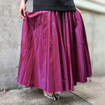 Magenta pleated midi skirt with gathered waistband, flowy A-line silhouette