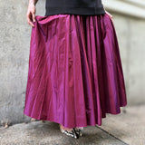 Magenta pleated midi skirt with gathered waistband, flowy A-line silhouette