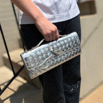 Bottega Veneta Andiamo clutch in silver with top handle and front clasp