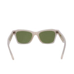 White cat-eye sunglasses with green lenses and pointed corners