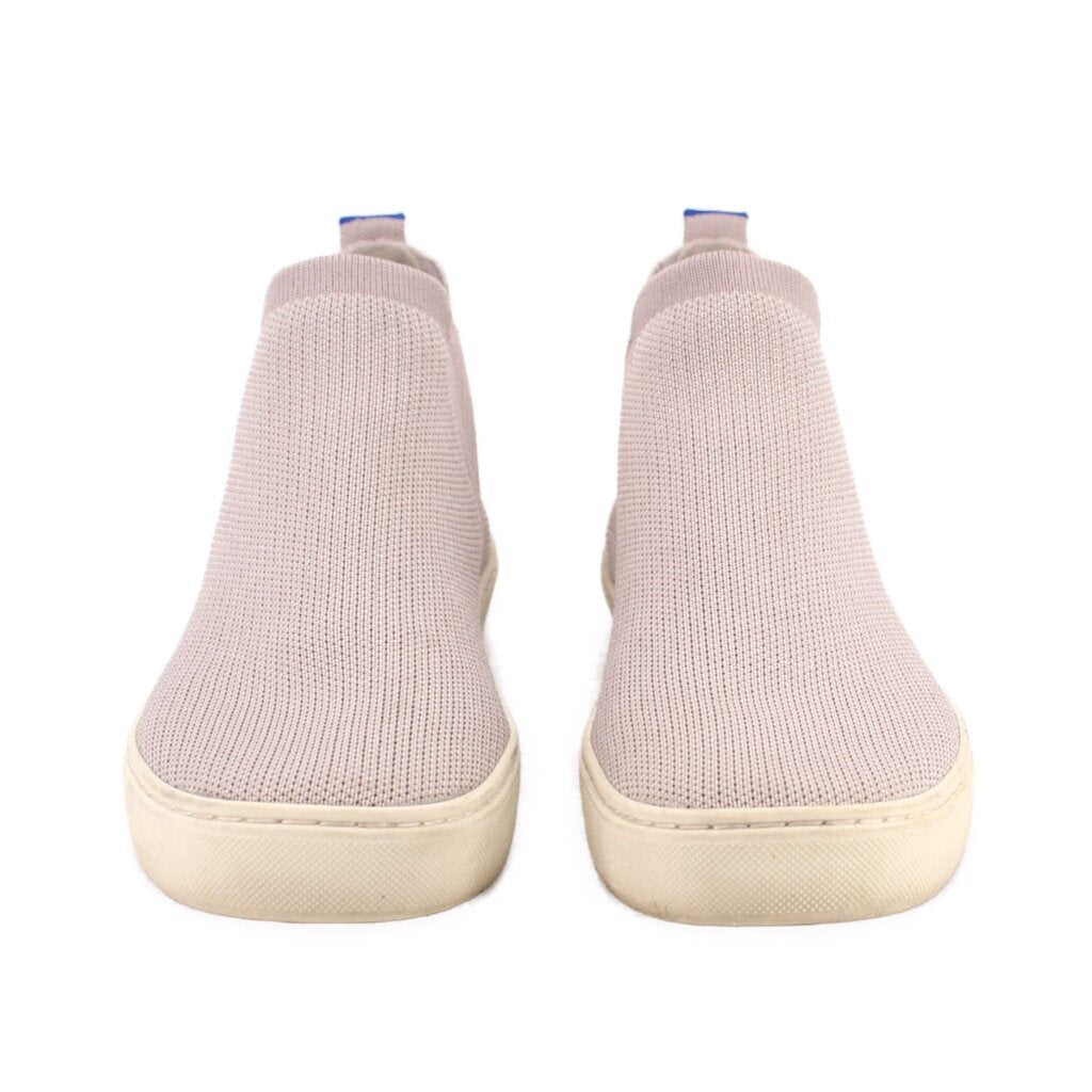 Pair of Chelsea ankle booties with light gray knit uppers and beige rubber soles