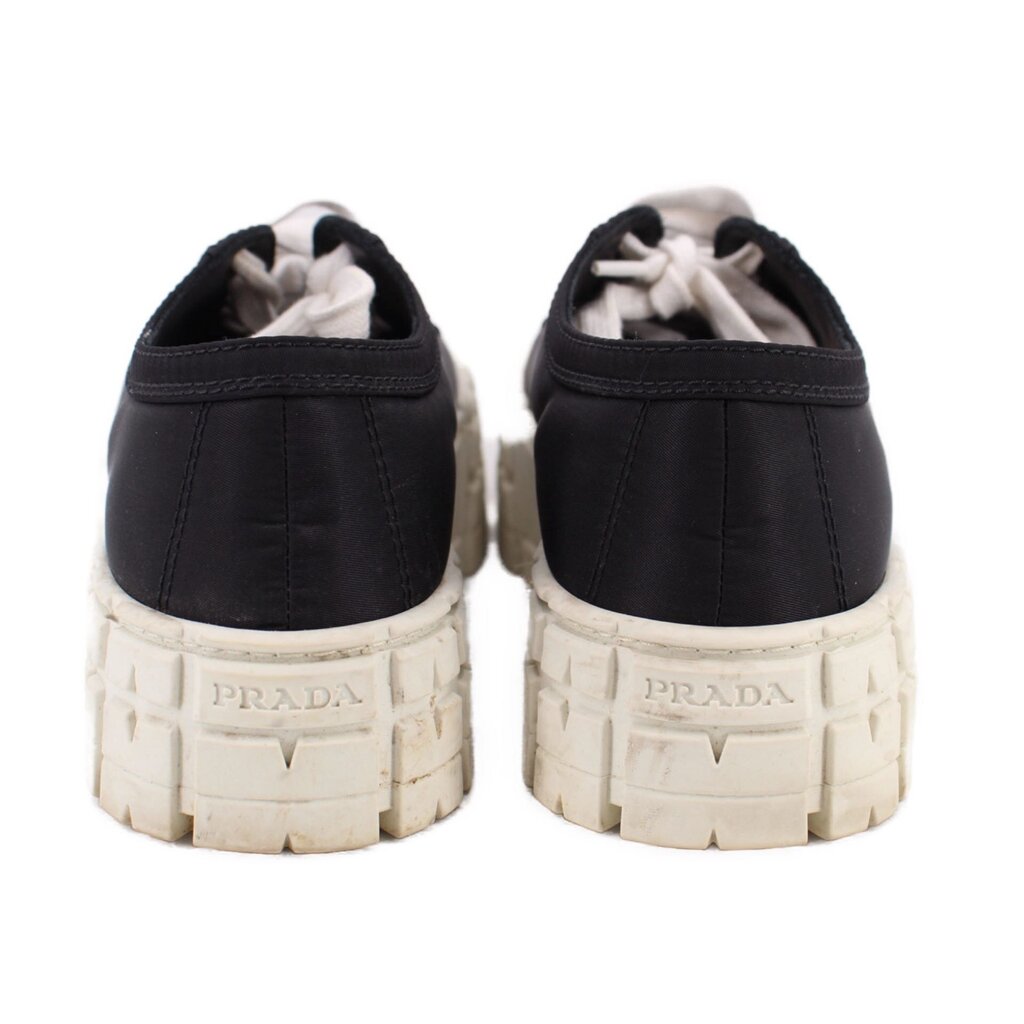 Prada black platform sneakers with rear branding on textured light midsoles