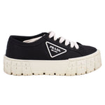 Prada black platform sneakers with PRADA logo patch and chunky light sole