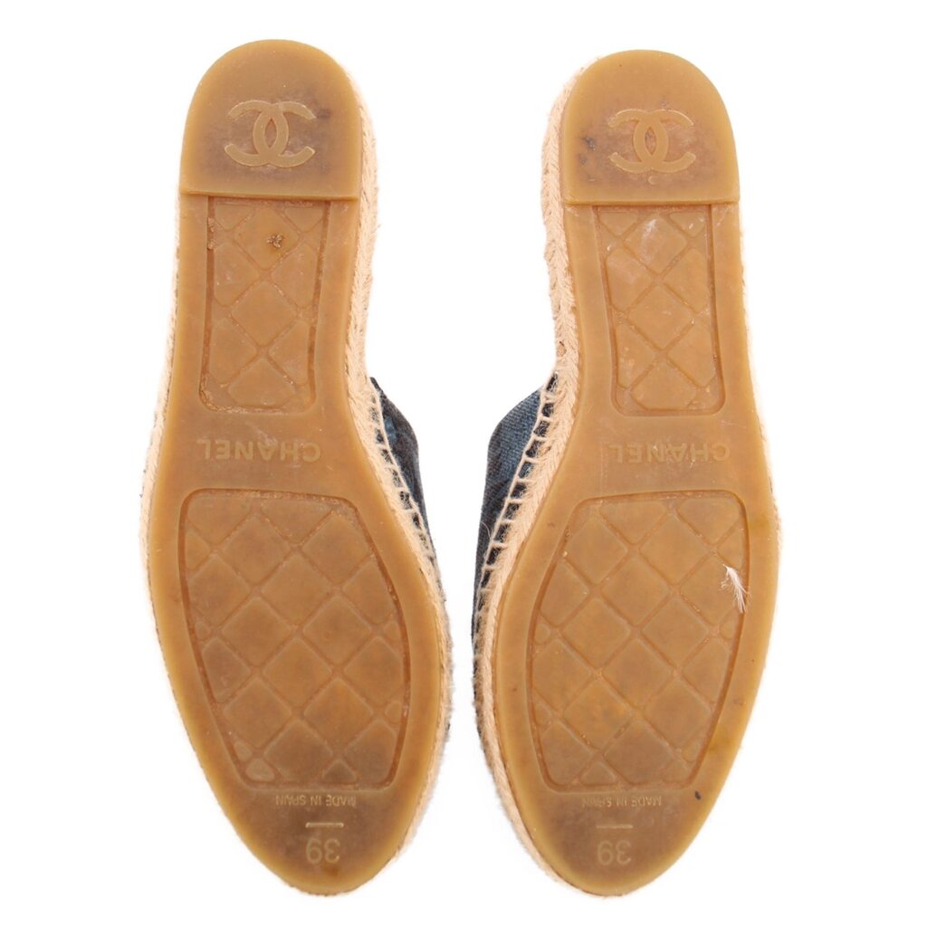 Outsoles of blue espadrille flats with tan rubber and CHANEL logo