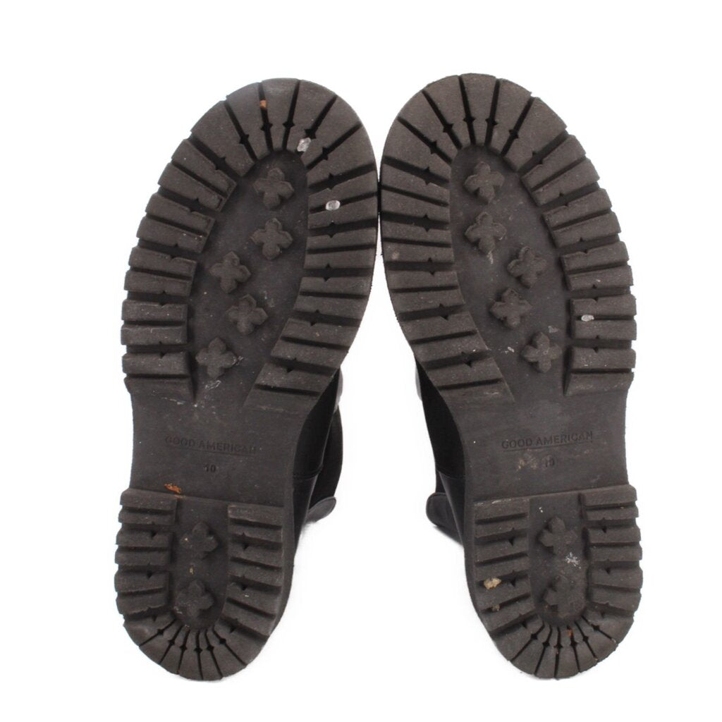 Black platform boot outsoles with deep tread pattern