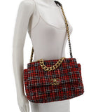 Red tweed 19 flap shoulder bag worn crossbody on model with chain strap