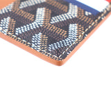 Men’s card case wallet corner close-up, orange edge trim and dark monogram fabric