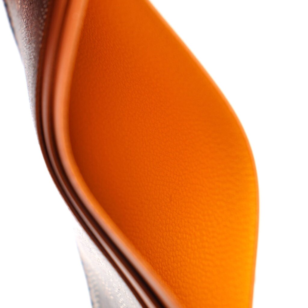 Men’s card case wallet interior, orange leather lining with curved edge