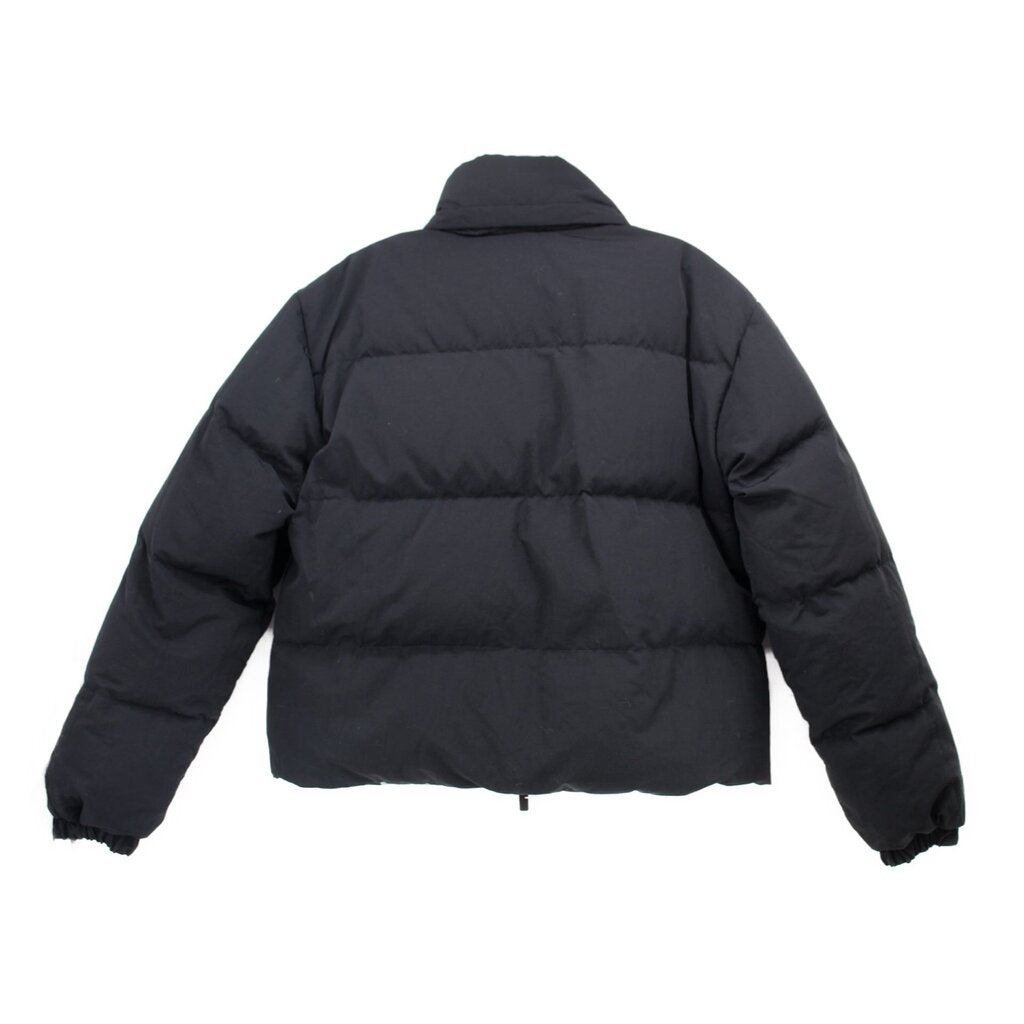Reversible puffer outerwear back view, dark quilted shell, zip front, hood