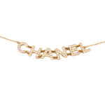 Gold-tone crystal logo necklace with repeating geometric link panel and secure chain
