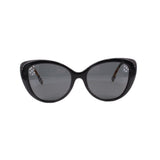 Cat-eye sunglasses, black frames with dark lenses, glossy finish