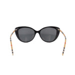 Cat-eye sunglasses, black front with check-pattern temple arms and dark lenses