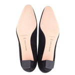 Black suede pumps soles and size markings on footbeds
