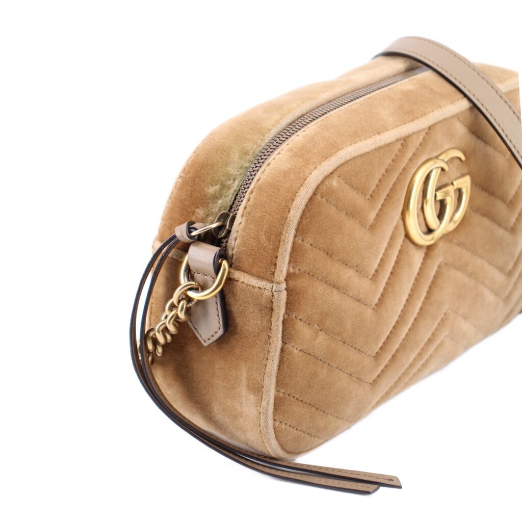 Tan velvet crossbody bag side view with gold GG plaque, zipper edge, and leather trim.