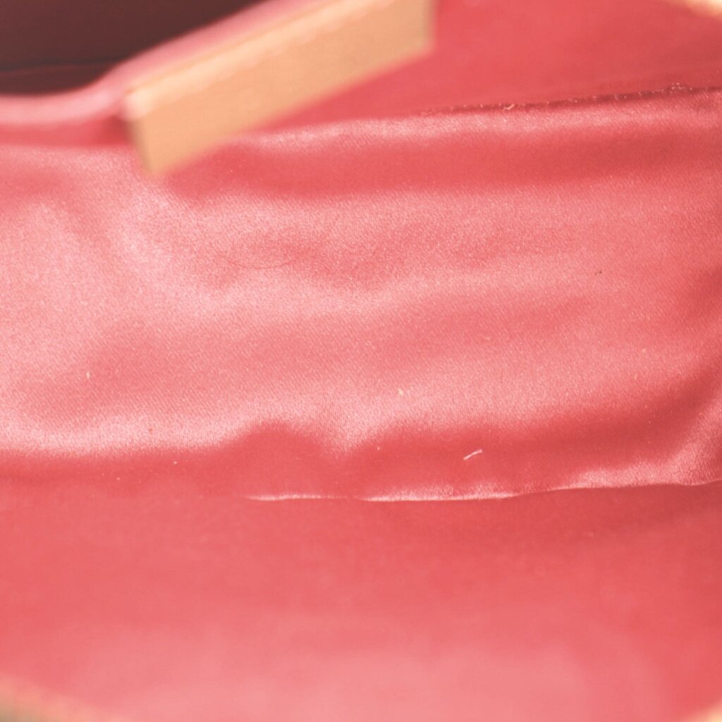 Red fabric lining inside GUCCI velvet crossbody bag