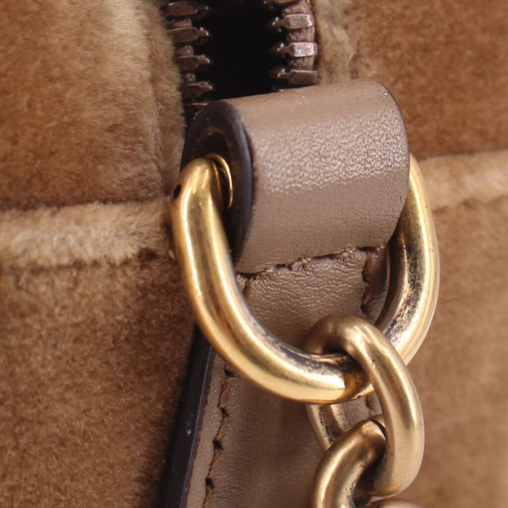 Brown velvet crossbody bag close-up of ring clasp and leather strap