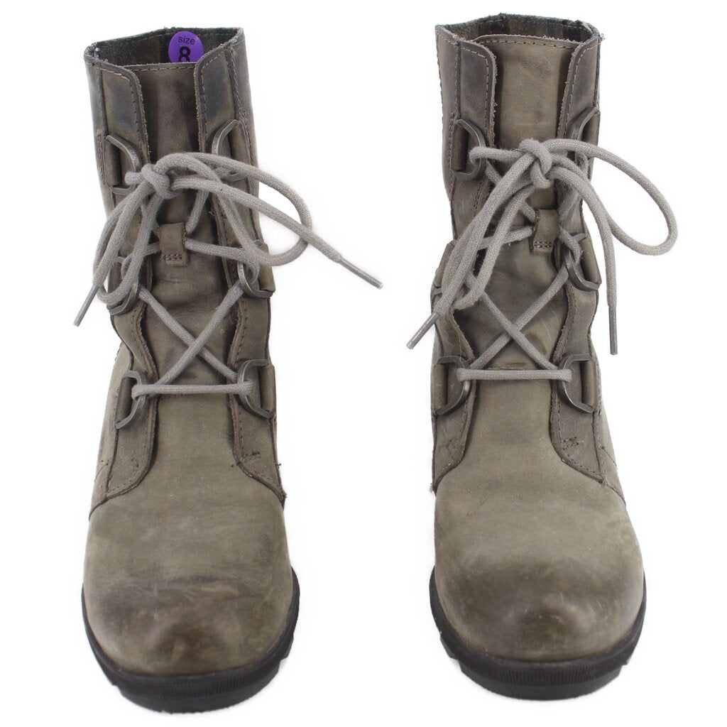 Pair of SOREL gray lace-up wedge booties shown from above