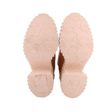 Nude platform boot soles with embossed AGL branding