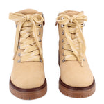 Pair of tan lace-up combat boots showing front and laces.