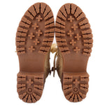 Tan boot outsoles with deep tread and star-pattern traction