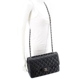 Black quilted jumbo double flap shoulder bag with CC logo on flap