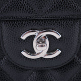CHANEL CC logo on black textured leather front of jumbo double flap bag
