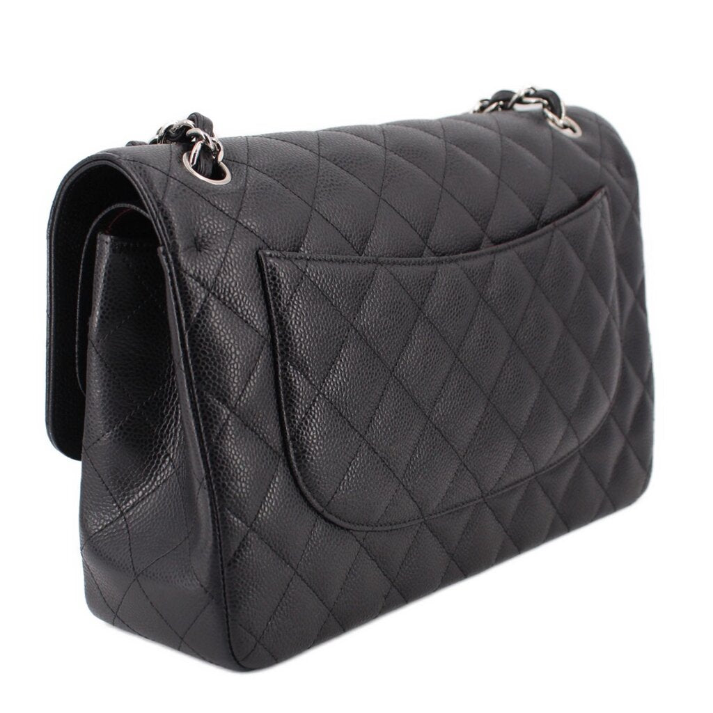 Black quilted jumbo double flap shoulder bag, side view with double chain strap and flap pocket