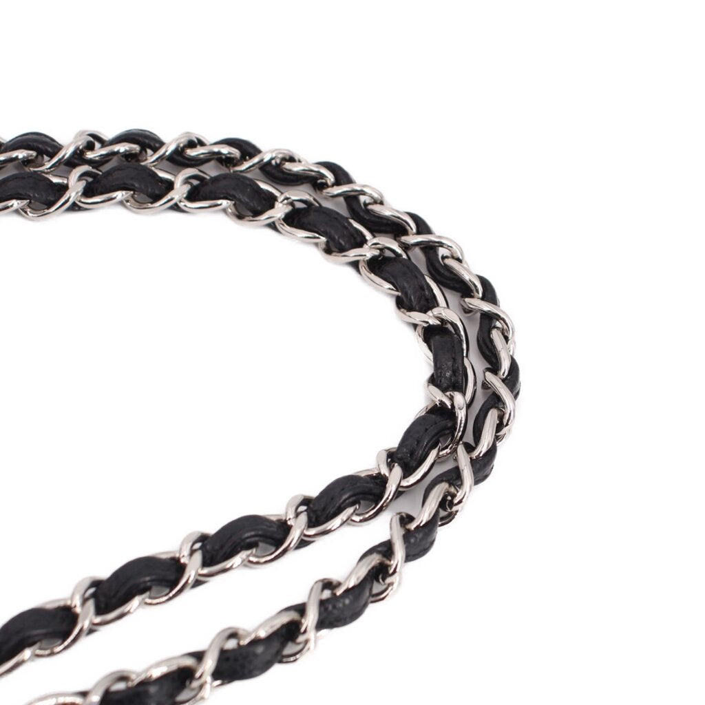Black double flap shoulder bag chain detail with silver-tone links