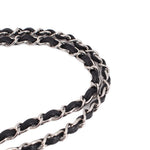 Black double flap shoulder bag chain detail with silver-tone links