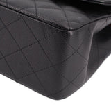 Black quilted leather corner with stitched diamond pattern on jumbo double flap bag