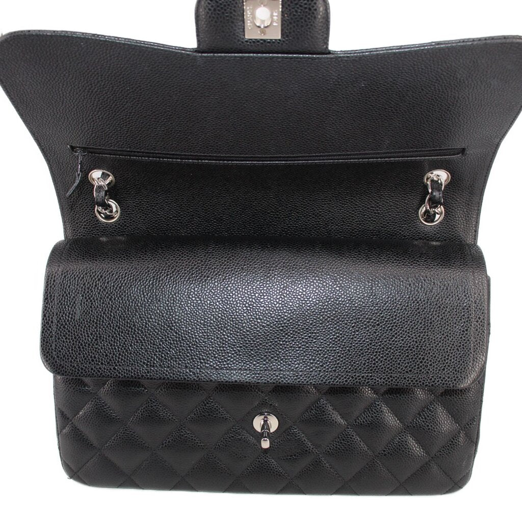 Black jumbo double flap shoulder bag open top with snap hardware and interior compartment