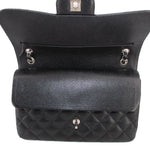 Black jumbo double flap shoulder bag open top with snap hardware and interior compartment