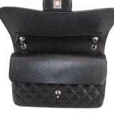 Black jumbo double flap shoulder bag open top with snap hardware and interior compartment
