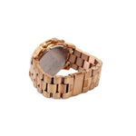 Rose gold watch with metal link bracelet showing the caseback underside