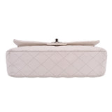 Off-white CHANEL double flap shoulder bag back view with small top snap bar