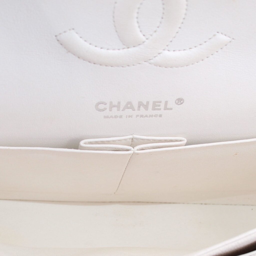 CHANEL interior logo panel on chalk white double flap bag, with stitched opening