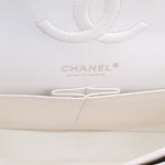 CHANEL interior logo panel on chalk white double flap bag, with stitched opening