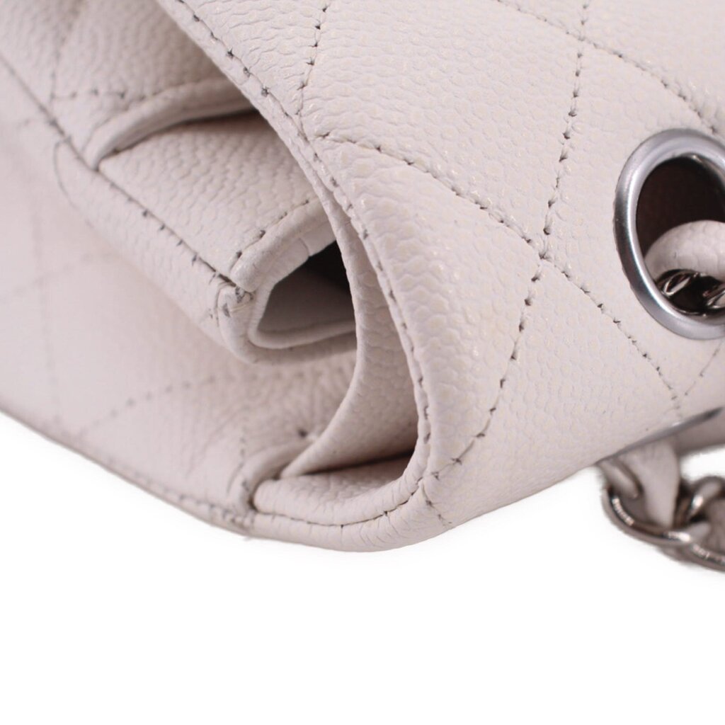 Chalk bag opening close-up with interior lining and metal chain attachment ring