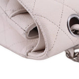 Chalk bag opening close-up with interior lining and metal chain attachment ring