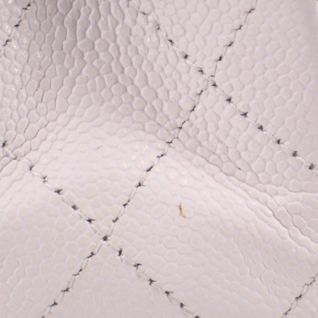 Chalk quilted leather panel detail with diamond stitching on handbag flap