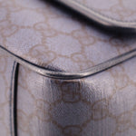 Gucci Ophidia crossbody bag top edge close-up with rounded piping and GG pattern.