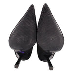 Black heeled bootie pair, pointed toe, visible outsole and heel