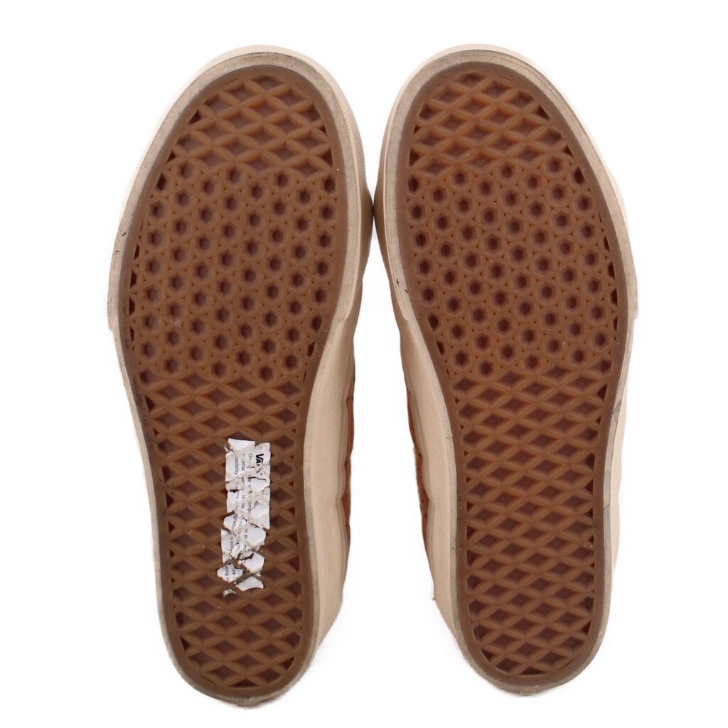High-top sneaker outsoles with brown waffle traction tread and off-white edges