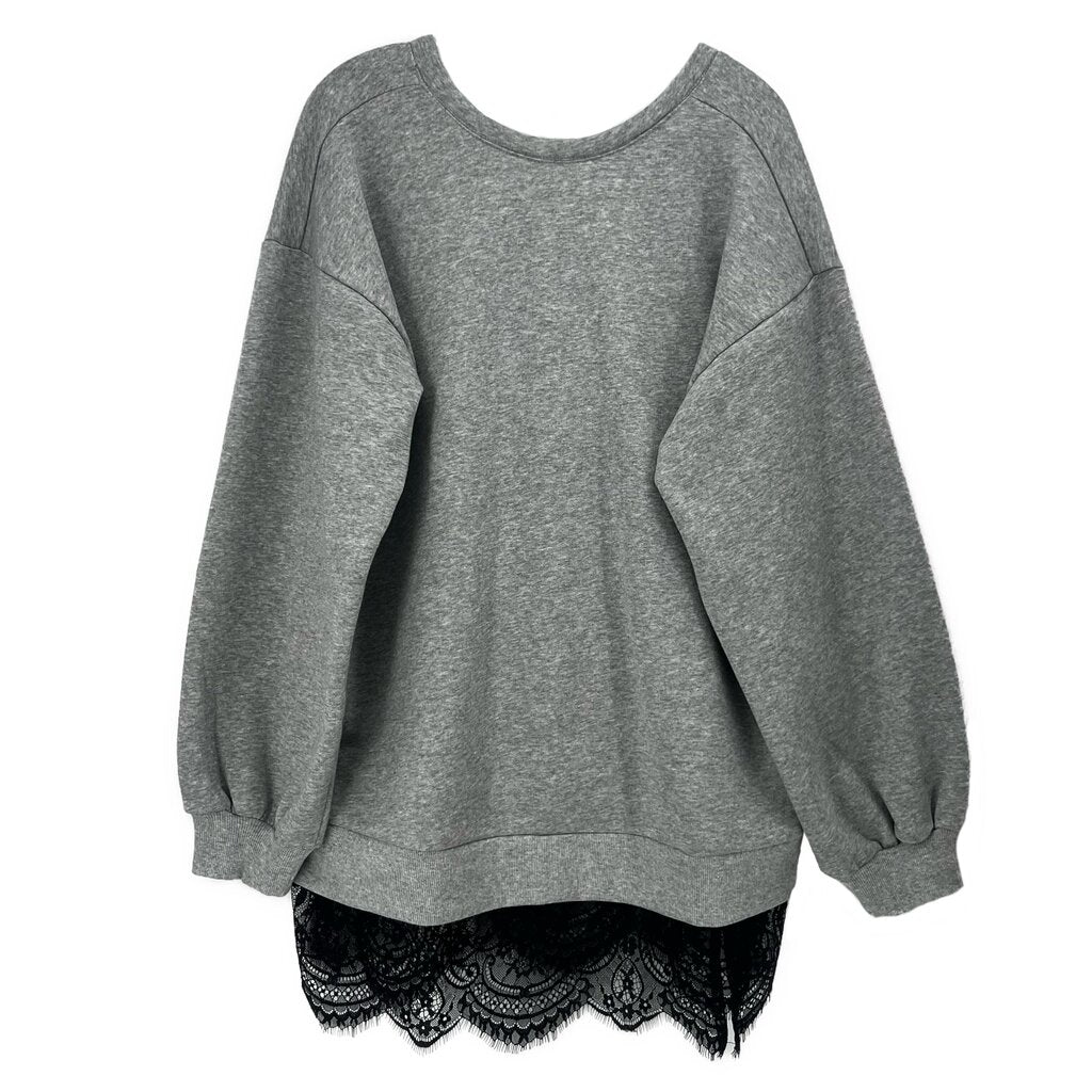 Gray tunic top with wide sleeves and crew neck; lace trim at high-low hem.