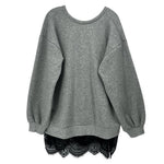 Gray tunic top with wide sleeves and crew neck; lace trim at high-low hem.