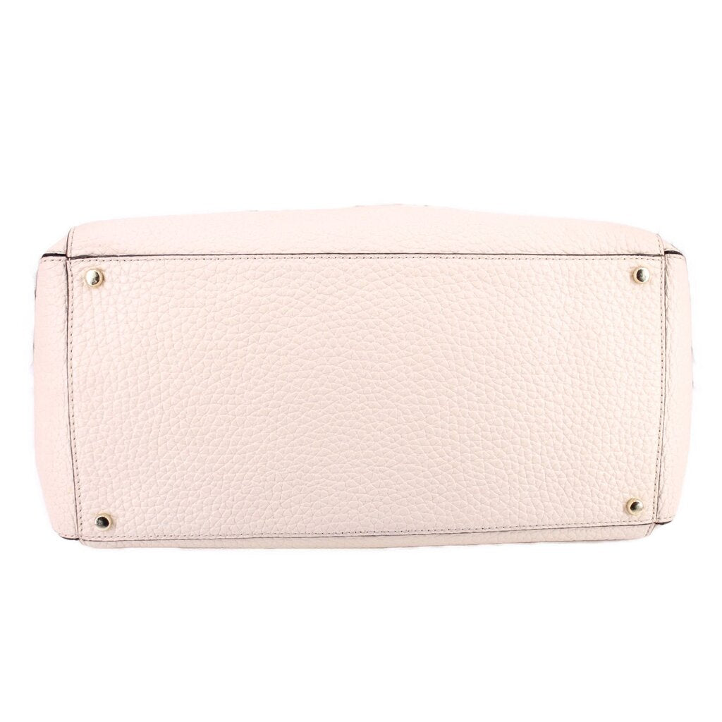 Cream leather Thatcher tote, bottom view with metal feet and reinforced base