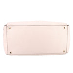 Cream leather Thatcher tote, bottom view with metal feet and reinforced base