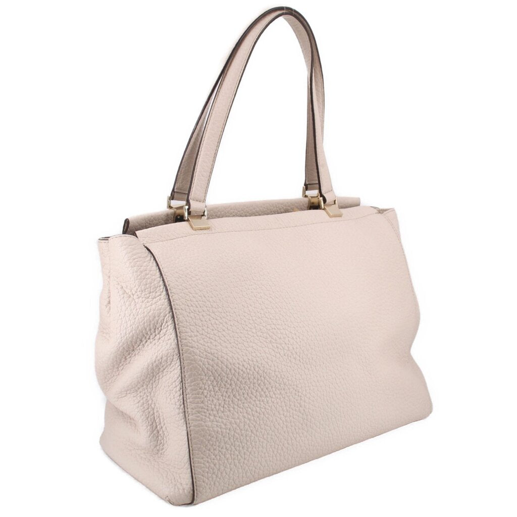 Cream leather Thatcher tote, side profile with top handles and roomy body